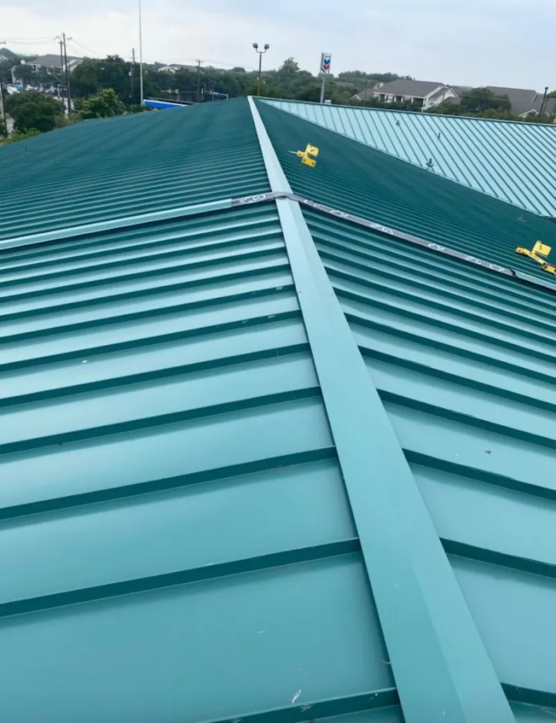 Green commercial metal roof ridge and valley for Metal Roof Repair in Boulder