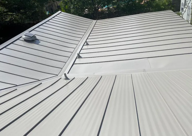 Solar attic fan installed on a metal roof for Roof Ventilation in Boulder