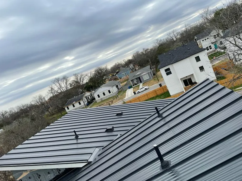 Standing seam metal roof panels with vents for Skylight Repair in Boulder